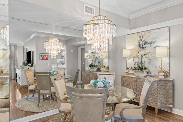 1 Beach Club Dr Unit 1205, Miramar Beach, FL 32550 - dining space with a chandelier, wood finished floors, ornamental molding, and baseboards