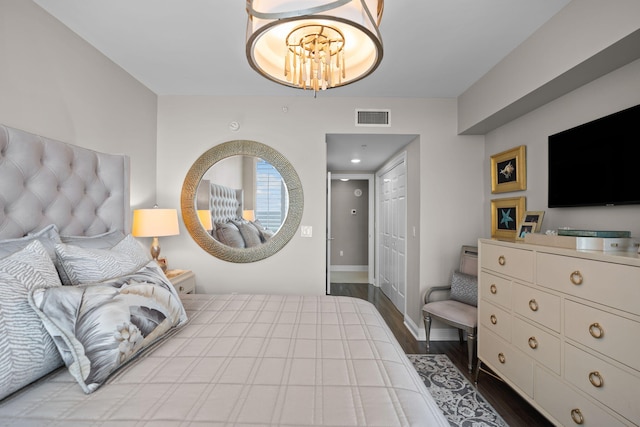 1 Beach Club Dr Unit 1205, Miramar Beach, FL 32550 - bedroom featuring wood finished floors, a chandelier, and baseboards