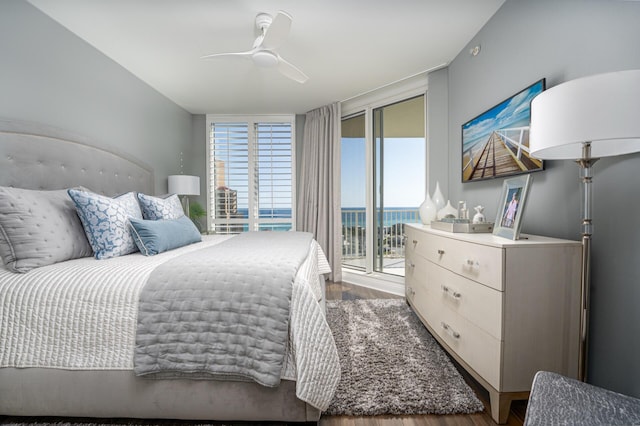 1 Beach Club Dr Unit 1205, Miramar Beach, FL 32550 - bedroom featuring access to exterior, wood finished floors, ceiling fan, and expansive windows