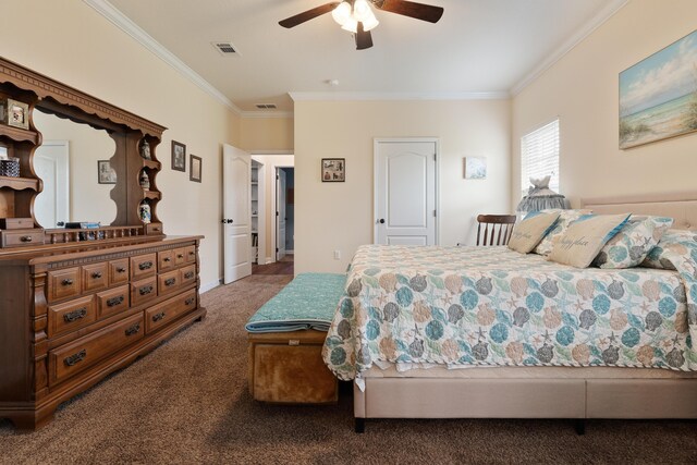 carpeted bedroom with visible vents, crown molding, and ceiling fan