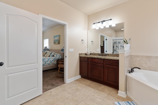 bathroom featuring tile patterned flooring, vanity, a bath, ensuite bath, and a shower