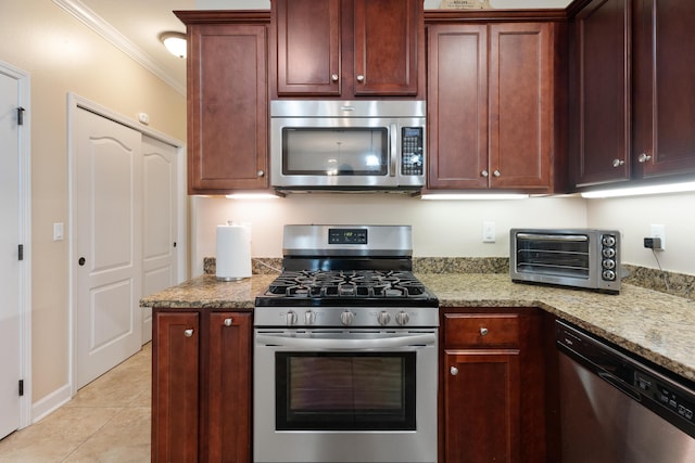 kitchen with crown molding, appliances with stainless steel finishes, light stone countertops, and a toaster