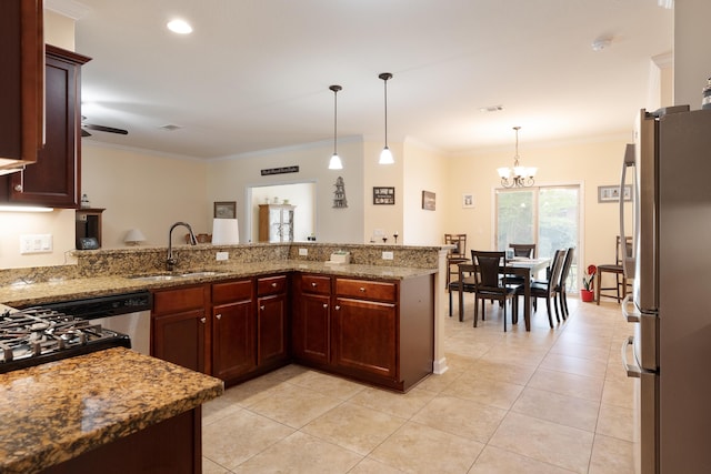kitchen with a sink, visible vents, freestanding refrigerator, a chandelier, and light tile patterned floors