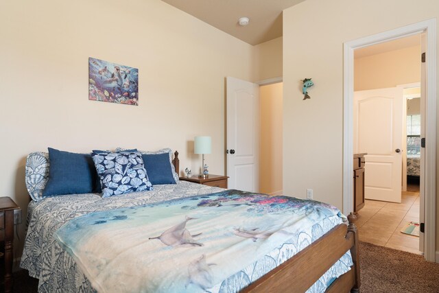 tiled bedroom with carpet floors