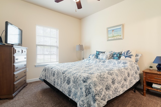 bedroom with carpet floors, a ceiling fan, and baseboards