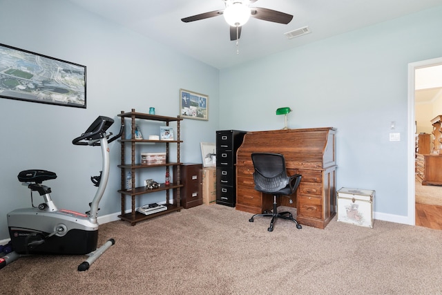 home office with ceiling fan, carpet floors, visible vents, and baseboards
