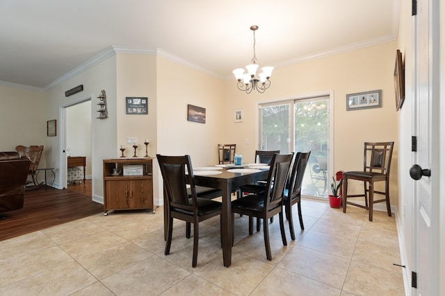 dining area with a chandelier, baseboards, ornamental molding, and light tile patterned floors