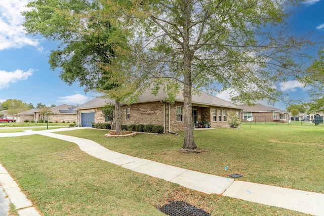 ranch-style house with a garage, brick siding, a front yard, and concrete driveway