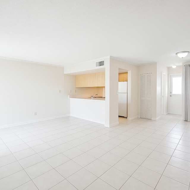 101 Old Ferry Rd Unit 5A, Shalimar, FL 32579 - unfurnished living room featuring light tile patterned floors, baseboards, and visible vents