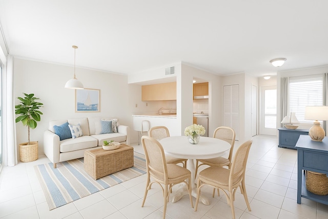 101 Old Ferry Rd Unit 5A, Shalimar, FL 32579 - dining area featuring light tile patterned flooring, crown molding, and visible vents
