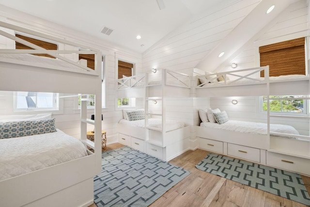 76 Tall Timber Ct, Santa Rosa Beach, FL 32459 - bathroom featuring lofted ceiling, visible vents, wood finished floors, and recessed lighting