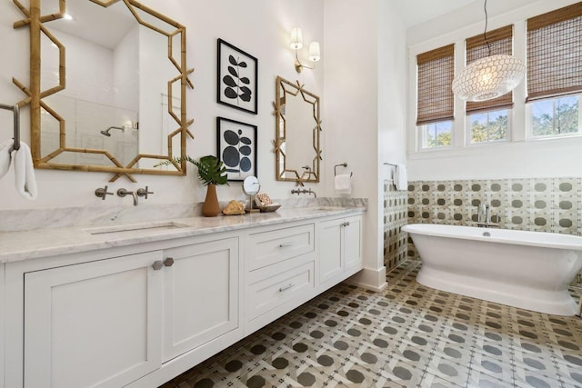 76 Tall Timber Ct, Santa Rosa Beach, FL 32459 - full bath with double vanity, a sink, walk in shower, and a freestanding bath