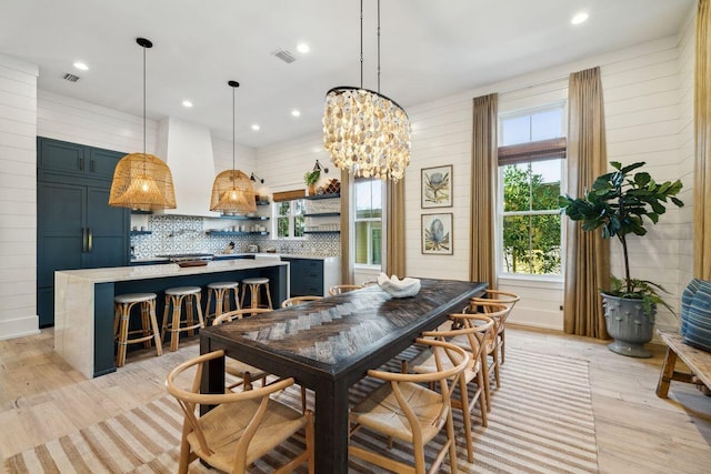 76 Tall Timber Ct, Santa Rosa Beach, FL 32459 - dining space with light wood-style flooring, visible vents, and a chandelier