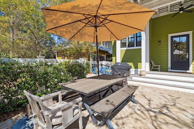 76 Tall Timber Ct, Santa Rosa Beach, FL 32459 - view of patio / terrace with a ceiling fan, outdoor dining area, and fence