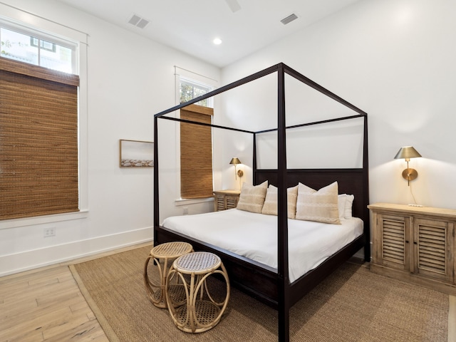 76 Tall Timber Ct, Santa Rosa Beach, FL 32459 - bedroom with baseboards, visible vents, recessed lighting, and wood finished floors