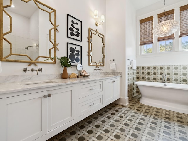 76 Tall Timber Ct, Santa Rosa Beach, FL 32459 - bathroom featuring a soaking tub, double vanity, a sink, and walk in shower