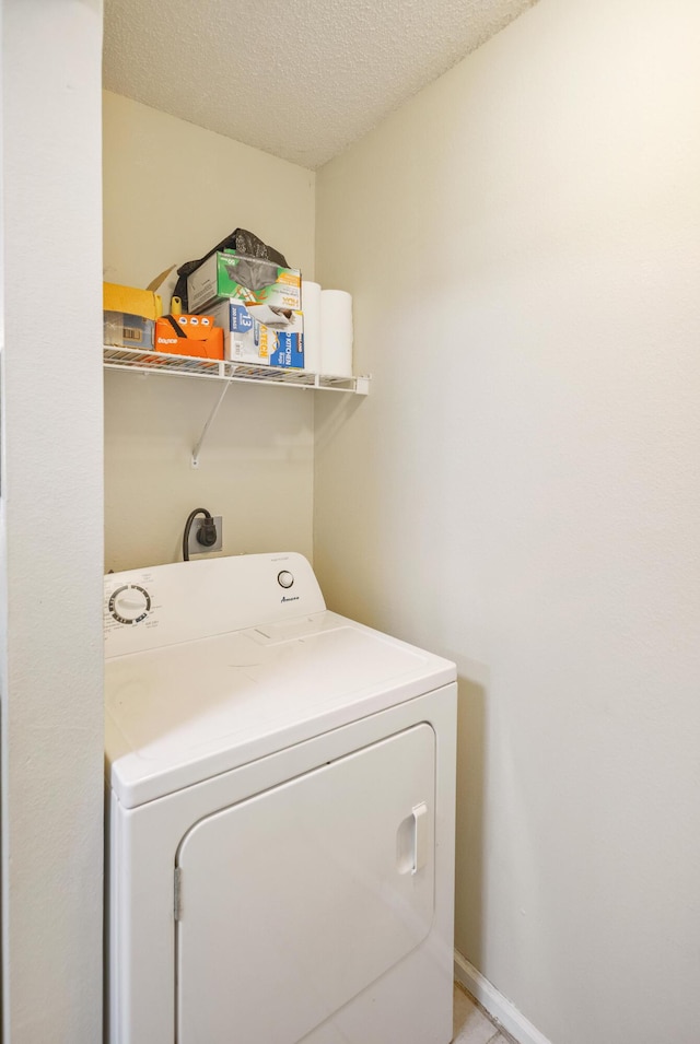 4000 Dancing Cloud Ct Unit 15, Destin, FL 32541 - laundry area featuring a textured ceiling, washer / dryer, and laundry area