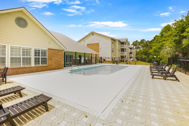 4000 Dancing Cloud Ct Unit 15, Destin, FL 32541 - community pool with a patio area and fence