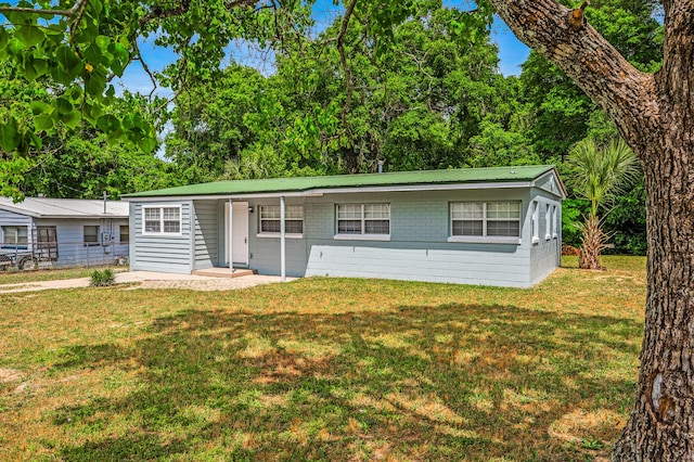 single story home featuring metal roof