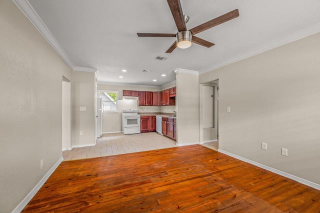 unfurnished living room featuring ceiling fan, crown molding, baseboards, a sink, and light wood-type flooring