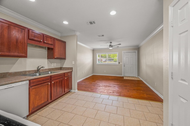 kitchen featuring white dishwasher, a sink, crown molding, a ceiling fan, and light tile patterned floors