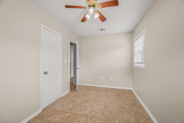 unfurnished bedroom with baseboards and a ceiling fan