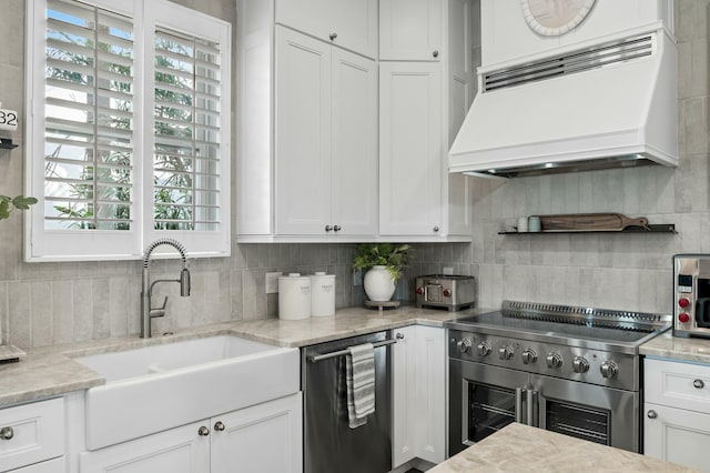 3592 Waverly Cir, Destin, FL 32541 - kitchen featuring custom exhaust hood, a healthy amount of sunlight, a sink, and stainless steel appliances