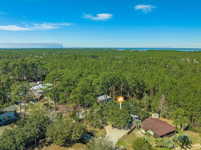 birds eye view of property with a forest view