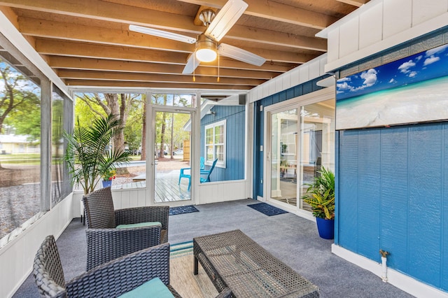 sunroom / solarium with a ceiling fan