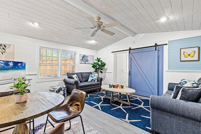living room with lofted ceiling with beams, wooden ceiling, wood finished floors, and a barn door