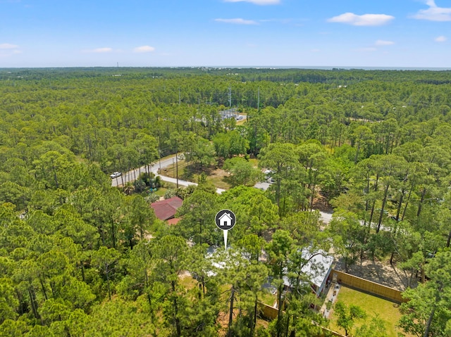 aerial view featuring a wooded view
