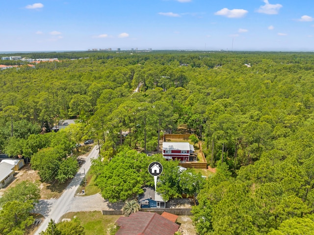 birds eye view of property with a forest view
