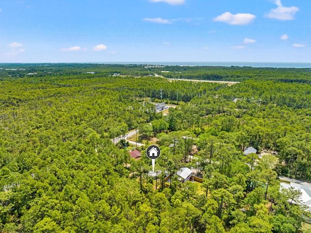 birds eye view of property with a wooded view
