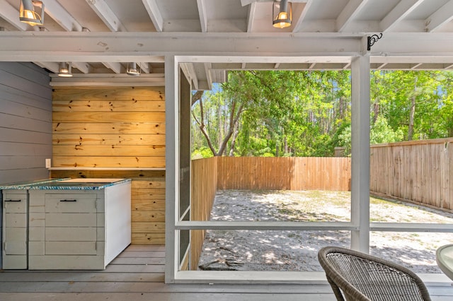 entryway with wooden walls and wood-type flooring