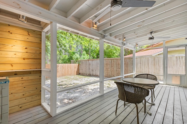 wooden deck with a ceiling fan and a fenced backyard