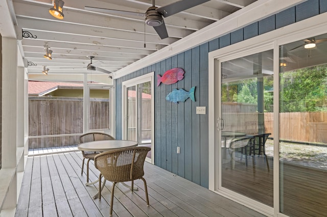 sunroom / solarium with ceiling fan