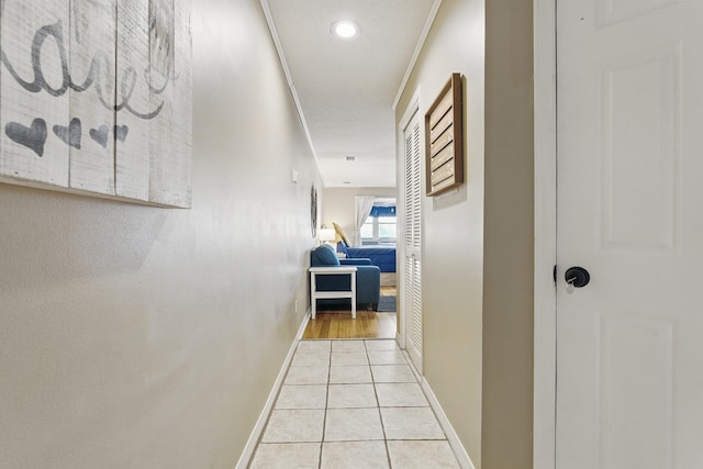 8730 Thomas Dr # 1210, Panama City Beach, FL 32408 - corridor featuring light tile patterned floors and baseboards