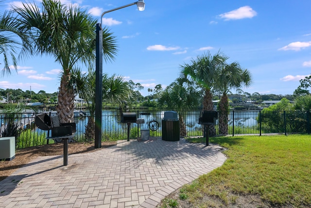 8730 Thomas Dr # 1210, Panama City Beach, FL 32408 - view of patio / terrace featuring a water view and fence
