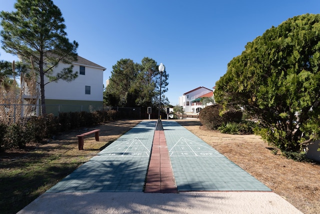 8730 Thomas Dr # 1210, Panama City Beach, FL 32408 - view of property's community with fence and shuffleboard