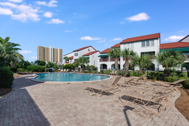 8730 Thomas Dr # 1210, Panama City Beach, FL 32408 - pool featuring fence and a patio