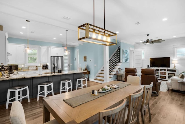 dining space featuring stairway, ceiling fan, light wood-style flooring, and recessed lighting