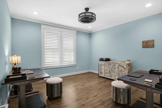 home office featuring crown molding, wood finished floors, baseboards, and recessed lighting