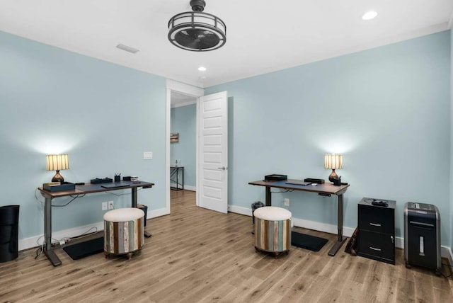 home office featuring wood finished floors, baseboards, and recessed lighting