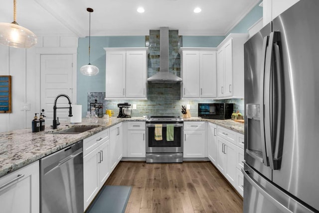 161 Lakewood Dr, Santa Rosa Beach, FL 32459 - kitchen featuring appliances with stainless steel finishes, a sink, wall chimney range hood, white cabinetry, and recessed lighting