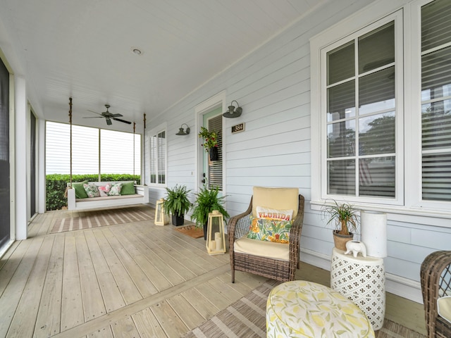 384 Carson Oaks Ln, Santa Rosa Beach, FL 32459 - wooden deck featuring covered porch and ceiling fan