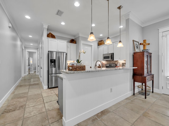 384 Carson Oaks Ln, Santa Rosa Beach, FL 32459 - kitchen with stainless steel appliances, stone tile floors, decorative backsplash, baseboards, and a peninsula
