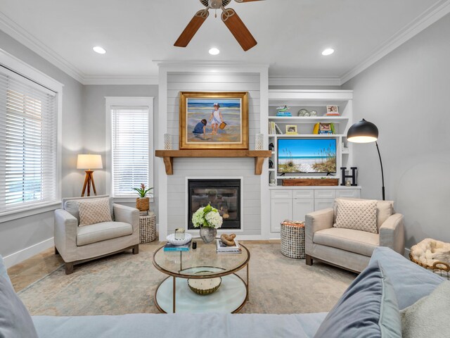384 Carson Oaks Ln, Santa Rosa Beach, FL 32459 - living area featuring baseboards, ceiling fan, a fireplace, ornamental molding, and built in shelves