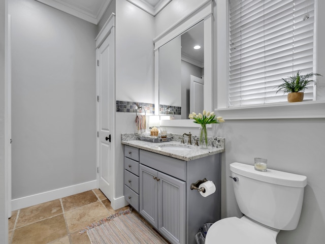 384 Carson Oaks Ln, Santa Rosa Beach, FL 32459 - bathroom featuring ornamental molding, toilet, vanity, baseboards, and stone finish flooring
