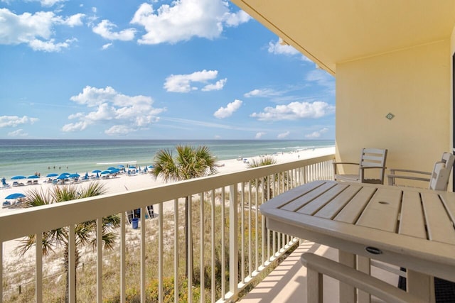 balcony with a view of the beach and a water view