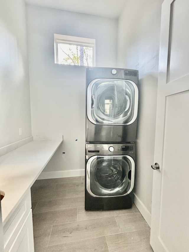 LOT11 E Georgie Pt, Washington, FL 32459 - washroom with estacked washer and dryer, wood finished floors, and baseboards